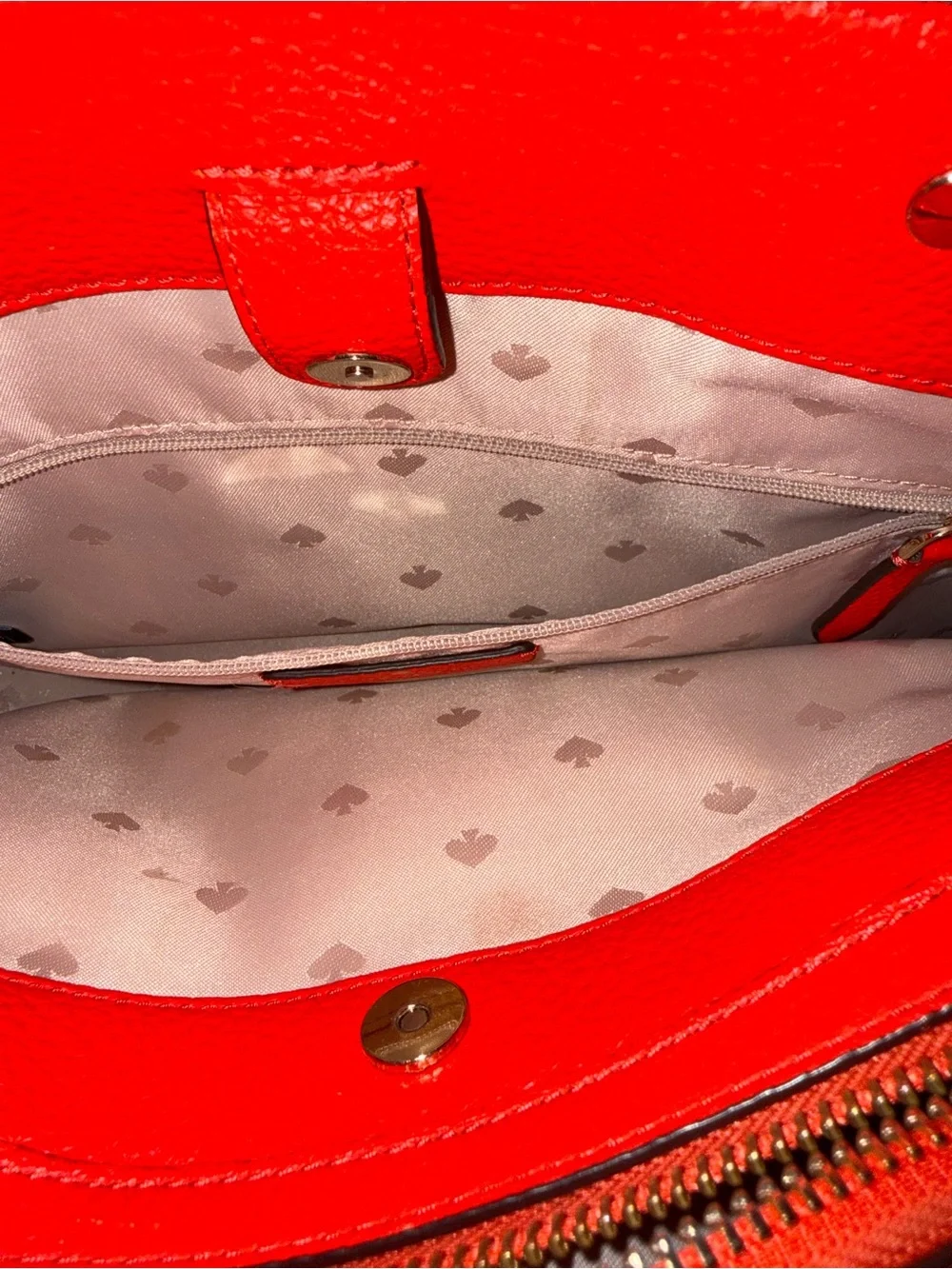 kate spade red pebbled leather satchel with polished hardware